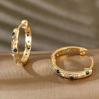 Gold Tone Copper Alloy Hoop Earrings with Blue Zircons