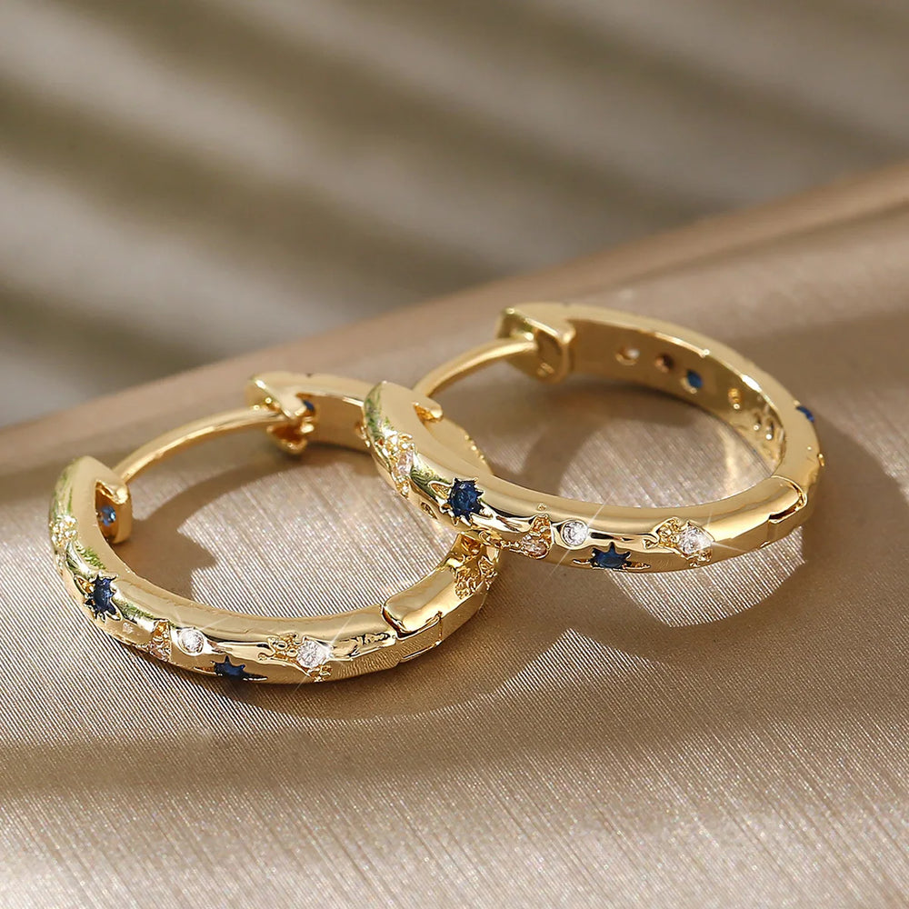 Gold Tone Copper Alloy Hoop Earrings with Blue Zircons